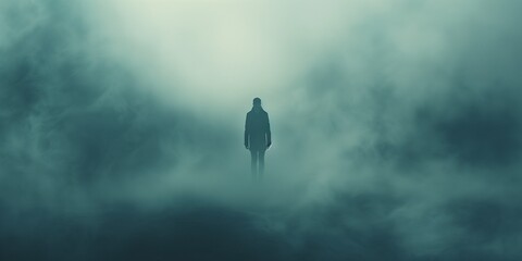 dark silhouette of a man coming out of a misty fog scary - obrazy, fototapety, plakaty