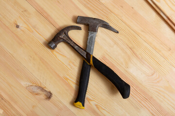 carpenter's tools. two hammers on wooden floor.