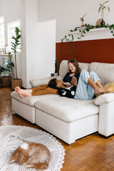 Relaxed couple enjoying a cozy moment on living room sofa