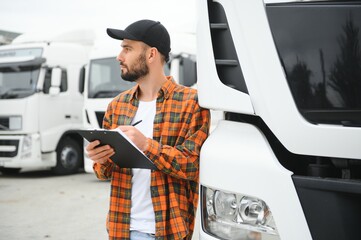 Men driver near lorry truck. Man owner truck driver near truck. Man trucker trucking owner....
