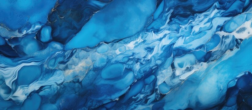 A close up of an aqua and electric blue marble painting with a waterlike pattern, resembling a liquid sky in darkness, freezing landscape. Art