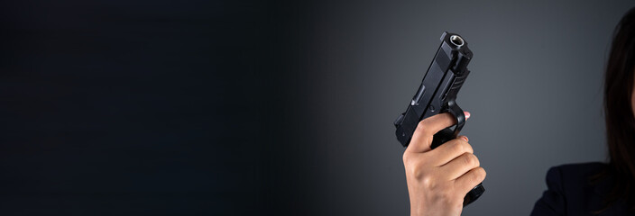 Woman holding a gun