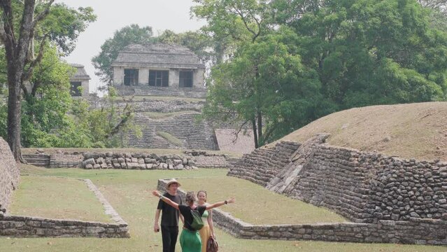 couple in Mayan ruins in Palenque, Chiapas, Mexico.