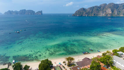 Long beach at Koh Phi Phi island, Krabi, Thailand. Tropical paradise white sand beach with turquoise waters of Andaman sea, aerial view of Koh Phi Phi Don and Koh Phi Phi Lee.