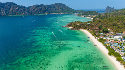 Long beach at Koh Phi Phi island, Krabi, Thailand. Tropical paradise white sand beach with turquoise waters of Andaman sea, aerial view towards Tonsai bay.