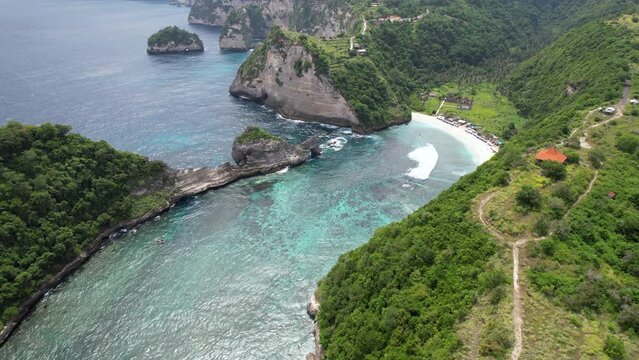 Aerial footage of Atuh Beach on sunny day. Nusa Penida Island, Indonesia.