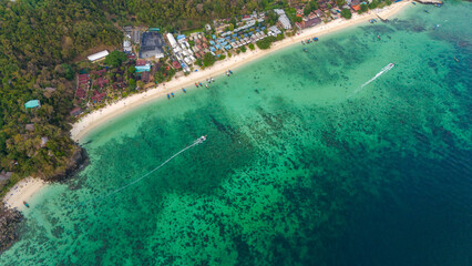Long beach at Koh Phi Phi island, Krabi, Thailand. Tropical paradise white sand beach with turquoise waters of Andaman sea, aerial view. 