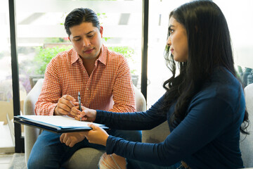 Businessman in casual clothing getting ready to sign a contract