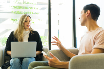 Businesspeople in casual clothes having a discussion about work