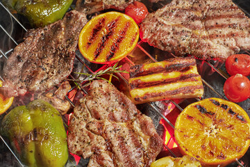 Assorted delicious grilled meat with vegetables on a grill - 761813190