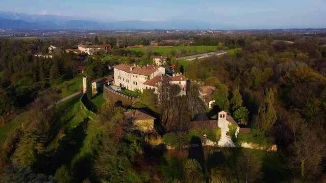 Sunset over the ancient manor of Arcano. Friuli seen from above.