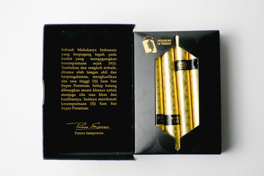 Open up a pack of Sampoerna Dji Sam Soe Super Premium cigarettes isolated on white background. Front view.