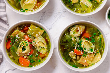Cabbage soup with eggs roll in a ceramic bowl on a table.  .style hugge