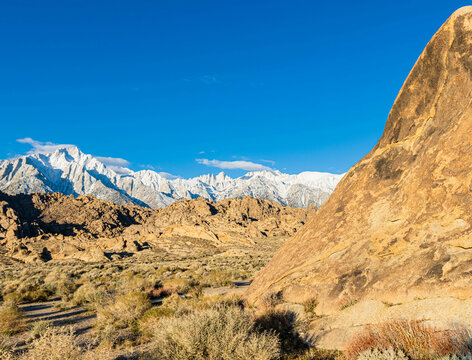 The Eroded Landscape of The Alabama Hills and The Snow Capped Sierra Nevada Range, Alabama Hills National Scenic Area, California, USA