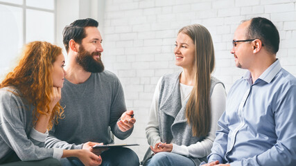 Therapist talking with patients during support group session