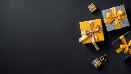 Top view yellow small gift box on gift box on empty black background, space for text, empty space for advertising