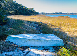 Small Boat on The Shore of Skull Creek at The Pope Squire Community Park, Hilton Head, South...