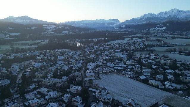 Scenic drone footage of the snowcapped Untersberg Mountain in Salzburg, Austria. Shot via drone in 4k at both sunrise and sunset. Along with the small town at the bottom of the mountain.