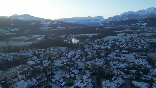 Scenic drone footage of the snowcapped Untersberg Mountain in Salzburg, Austria. Shot via drone in 4k at both sunrise and sunset. Along with the small town at the bottom of the mountain.