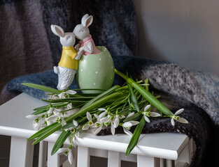 A still life arrangement of Easter eggs, spring flowers. Still life with snowdrops and ester eags. - 761823915