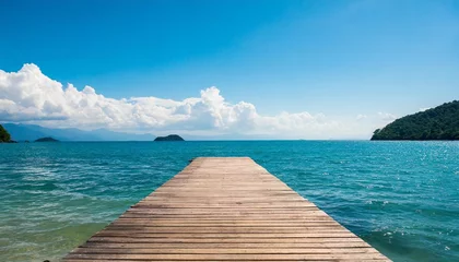Tuinposter wooden pier with blue sea and sky background © Nichole