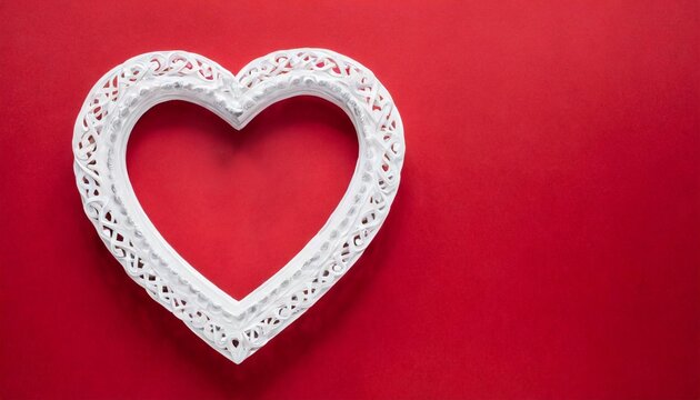 white heart frame on a red background with copy space