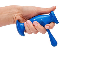 Trigger point massager in female hand on white background