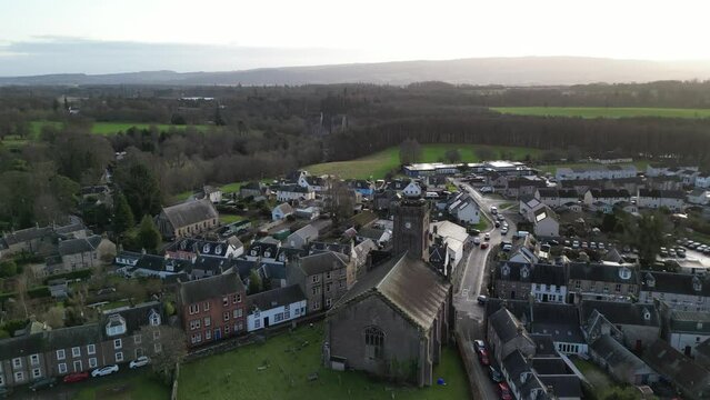 Kilmadock Parish Church, in Doune, Scotland, UK. Beautiful 14th-century church built to support the residence of Doune and the Castle. Scenic ascending drone footage of the church. 