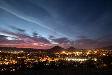 Beautiful elevated twilight sunset view of the evening lights of downtown San Luis Obispo,...
