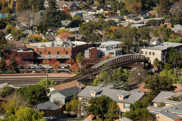 Afternoon light shines on a bridge and historic core of San Luis Obispo, California, USA.