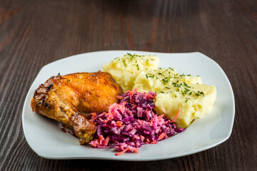 baked chicken leg, mashed potatoes and red cabbage salad - 761843133