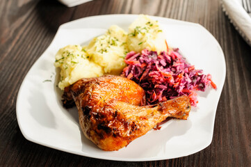 baked chicken leg, mashed potatoes and red cabbage salad - 761843139
