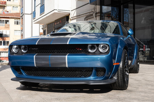 ISTANBUL, TURKEY - MARCH 12, 2023: Blue  2021 Dodge Challenger 6.4 SRT SCAT  automobile in car gallery autopark.