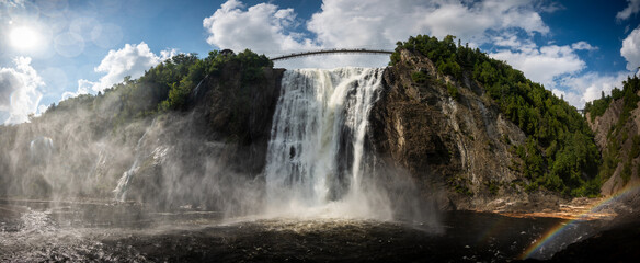 Dramatic Montmorency falls in Quebec, on a sunny summer day.