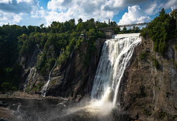 Dramatic Montmorency falls in Quebec, on a sunny summer day.