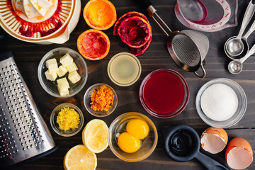 Overhead View of Prepped Bloood Orange Curd Ingreients: Citrus juice and zest with egg yolks,...