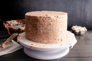 Chocolate Cake Crumb-Coated with Hazelnut Buttercream Frosting: Layer cake frosted with hazelnut...