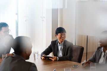Company management has a corporate business meeting with a business partner. Diverse business people meet in the office.