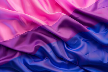 Obraz premium Bisexual pride flag, lgbtq+ colourful background with pink, purple and blue shades on fabric pleats