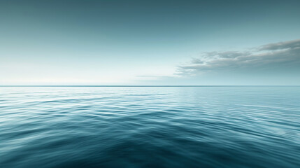 Obraz premium A calm and peaceful ocean with a clear blue sky above