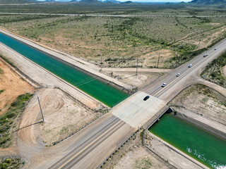 The Arizona Canal Project Near Sun City from and Aerial Drone showing the water flowing through the desert 