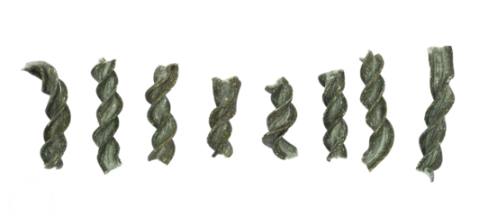 Set macro uncooked fusilli spirulina, organic dry pasta isolated on white, top view