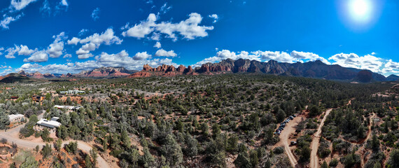 Sedona, Arizona Area Landscape on a Partly Cloudy day with parts of the Red Rock Park and a Blue Sky