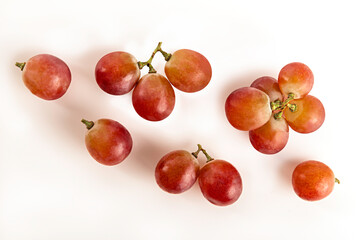 Flat lay of grapes on white background.