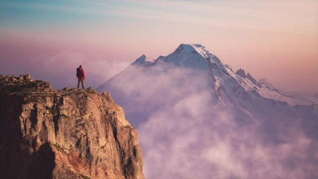 Man Hiker on dramatic rocky peak, mountains. Adventure Composite. 3d Rendering rocks. Background image from America. 3D Illustration