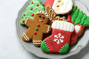 Tasty homemade Christmas cookies on light grey table, closeup