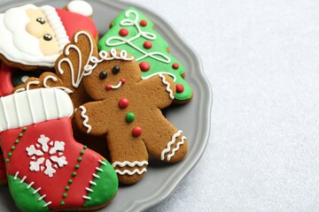 Tasty homemade Christmas cookies on light grey table, closeup. Space for text