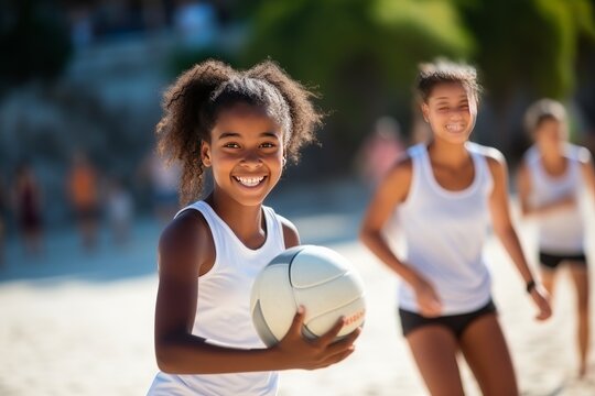 Young Women Playing Volleyball
