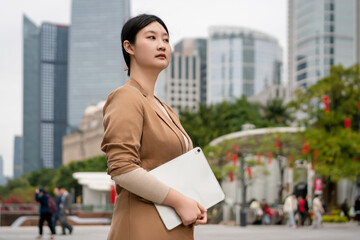 Confident Businesswoman Walking in City Landscape