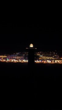 Jandia lighthouse at night aerial drone shot circling	
